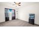 Bedroom with neutral carpet and walls, a window with decorative curtains, and a dresser at 11 Mamie Ferguson Dr, Lillington, NC 27546