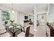 Bright dining area features a glass-top table and views of living room area at 11 Mamie Ferguson Dr, Lillington, NC 27546