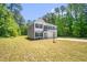 Two-story home featuring green lawn and mature trees in a quiet neighborhood at 11 Mamie Ferguson Dr, Lillington, NC 27546