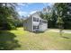 Side view of a charming two-story home with a manicured lawn at 11 Mamie Ferguson Dr, Lillington, NC 27546