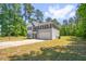 Two-story home featuring green lawn and mature trees in a quiet neighborhood at 11 Mamie Ferguson Dr, Lillington, NC 27546