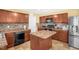 Kitchen featuring an island, stylish backsplash, and dark appliances at 11 Mamie Ferguson Dr, Lillington, NC 27546