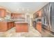 Efficient kitchen with center island, pantry and a sleek black appliance package at 11 Mamie Ferguson Dr, Lillington, NC 27546