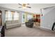 Open-concept living room showcasing comfortable seating and backyard access at 11 Mamie Ferguson Dr, Lillington, NC 27546