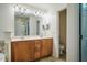 Bright bathroom featuring a double sink vanity and a separate toilet and shower room at 111 Florians Dr, Holly Springs, NC 27540