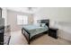 Bedroom with a queen bed, two nightstands, and natural light from a window at 111 Florians Dr, Holly Springs, NC 27540