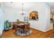 Cozy dining area with hardwood floors, ample natural light, and convenient access to the kitchen at 111 Florians Dr, Holly Springs, NC 27540