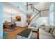 Open floor plan featuring a living room, dining area, kitchen and staircase at 111 Florians Dr, Holly Springs, NC 27540