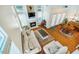 Bright living room with fireplace, built-ins, and access to a dining area and front entryway at 111 Florians Dr, Holly Springs, NC 27540