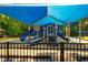 Community playground has slides, climbing structures, and shady canopies for sun protection at 111 Florians Dr, Holly Springs, NC 27540