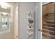 Hallway features a set of decorative shelves next to a door to stairs at 112 Parkspring Ct, Cary, NC 27519