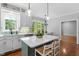 Lovely kitchen showcasing an island with seating, modern sink, and breakfast nook near a window at 112 Parkspring Ct, Cary, NC 27519
