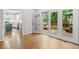 Spacious living room with hardwood floors and sliding doors to deck at 112 Parkspring Ct, Cary, NC 27519