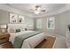 Bright main bedroom with tray ceilings, neutral walls, and large windows at 112 Parkspring Ct, Cary, NC 27519