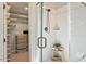 Modern shower with white subway tile, a glass door, and closet storage at 112 Parkspring Ct, Cary, NC 27519