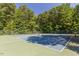 Well-maintained community tennis courts surrounded by trees, perfect for recreational play at 112 Parkspring Ct, Cary, NC 27519