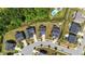 Aerial view showcases the neighborhood homes and landscaping, with a nearby swimming pool and cul-de-sac at 116 Chaseford Ct, Holly Springs, NC 27540