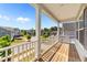 Charming balcony with a scenic view of the neighborhood and a wooden floor for relaxation at 116 Chaseford Ct, Holly Springs, NC 27540
