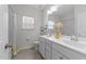 Clean bathroom with double sinks, white cabinets, and bright lighting for a refreshing experience at 116 Chaseford Ct, Holly Springs, NC 27540