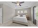 Inviting bedroom with neutral tones, a comfortable bed, and windows that offer natural light at 116 Chaseford Ct, Holly Springs, NC 27540