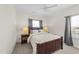 Comfortable bedroom with a ceiling fan, neutral colors, and natural light for a serene atmosphere at 116 Chaseford Ct, Holly Springs, NC 27540