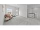 Bright bonus room features plush carpeting, natural light, and a flexible layout for recreation at 116 Chaseford Ct, Holly Springs, NC 27540