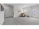 Spacious bonus room with plush carpeting, natural light, and versatile space for various activities at 116 Chaseford Ct, Holly Springs, NC 27540