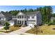 Attractive home with a double porch, complemented by lush landscaping and a well-maintained lawn at 116 Chaseford Ct, Holly Springs, NC 27540