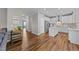 Open concept kitchen showcasing stainless steel appliances, white cabinetry, and a functional island at 116 Chaseford Ct, Holly Springs, NC 27540