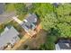 An aerial shot of a grey house with a newly installed deck and a well-maintained lawn at 116 Dallavia Ct, Morrisville, NC 27560