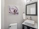 Stylish powder room featuring a vessel sink and modern fixtures at 116 Dallavia Ct, Morrisville, NC 27560