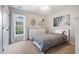 Bedroom with carpet, white bedding, a double door closet, a window, and a white dresser at 116 Dallavia Ct, Morrisville, NC 27560