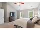 Large bedroom with vaulted ceilings, ample windows and natural light, neutral colored walls and carpet at 116 Dallavia Ct, Morrisville, NC 27560