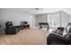 Spacious bedroom featuring a ceiling fan, plush carpet, seating and a foosball table for entertainment at 116 Dallavia Ct, Morrisville, NC 27560