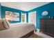 Teal bedroom featuring carpet, a window with curtains, a dresser and a white comforter at 116 Dallavia Ct, Morrisville, NC 27560