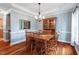 Charming dining room featuring wood floors, a decorative chandelier, and classic furnishings at 116 Dallavia Ct, Morrisville, NC 27560