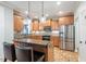 Bright kitchen with stainless steel appliances, granite countertops, and a breakfast bar at 116 Dallavia Ct, Morrisville, NC 27560