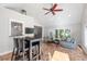 Open living area with a bar-style seating area that connects to a kitchen at 116 Dallavia Ct, Morrisville, NC 27560