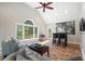 Bright living room with large windows offering natural light and backyard views at 116 Dallavia Ct, Morrisville, NC 27560