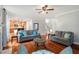 Spacious living room with hardwood floors, neutral decor, comfortable seating, and seamless kitchen access at 116 Dallavia Ct, Morrisville, NC 27560