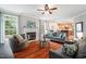 Inviting living room with fireplace, hardwood floors, comfortable seating, and plenty of natural light at 116 Dallavia Ct, Morrisville, NC 27560