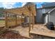 Cozy patio with a wooden pergola, ceiling fans, a stone accent wall and a grill for outdoor cooking at 116 Dallavia Ct, Morrisville, NC 27560