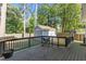 Back deck overlooking the backyard and shed featuring wood railings and a hammock-chair at 120 Foley Dr, Garner, NC 27529