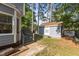 Backyard with well-maintained shed, lush lawn, and mature trees at 120 Foley Dr, Garner, NC 27529