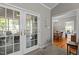 Living room with view to the outside patio and a separate dining room, offering seamless indoor-outdoor flow at 120 Foley Dr, Garner, NC 27529