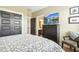 Cozy bedroom featuring a television, dresser, and adjacent bathroom entrance at 120 Mearleaf Pl, Holly Springs, NC 27540