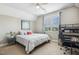 Cozy bedroom with a large window, natural light, a comfortable bed, and a dedicated workspace at 120 Mearleaf Pl, Holly Springs, NC 27540