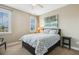 Inviting bedroom with soft lighting, a patterned bedspread, and a calming atmosphere at 120 Mearleaf Pl, Holly Springs, NC 27540