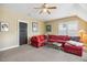 Bonus room featuring a red sectional sofa and a ceiling fan at 120 Mearleaf Pl, Holly Springs, NC 27540