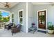 Cozy front porch featuring comfortable seating, stylish decor, and a charming entryway at 120 Mearleaf Pl, Holly Springs, NC 27540